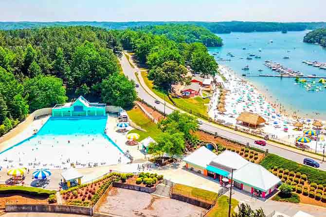 Drone shot overlooking pool and lake at Camp Margaritaville RV Resort Lanier Islands
